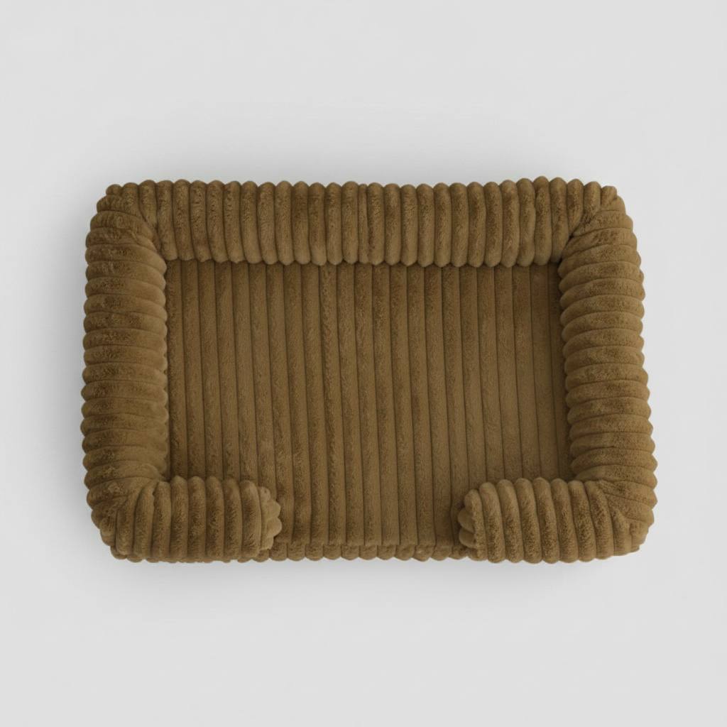 Brown plush bolster pet bed, top view showing ribbed corduroy texture and raised calming sides