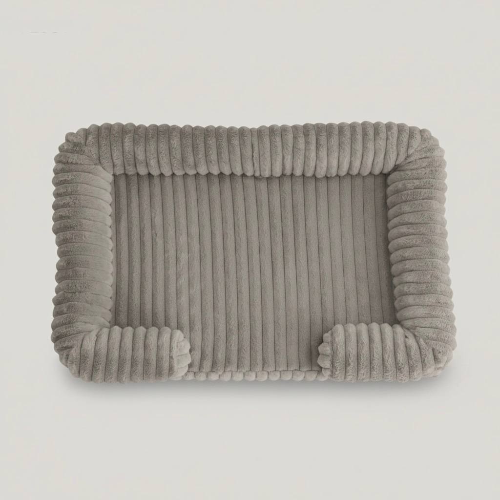 Light grey plush bolster pet bed, top view showing ribbed corduroy texture and raised calming sides
