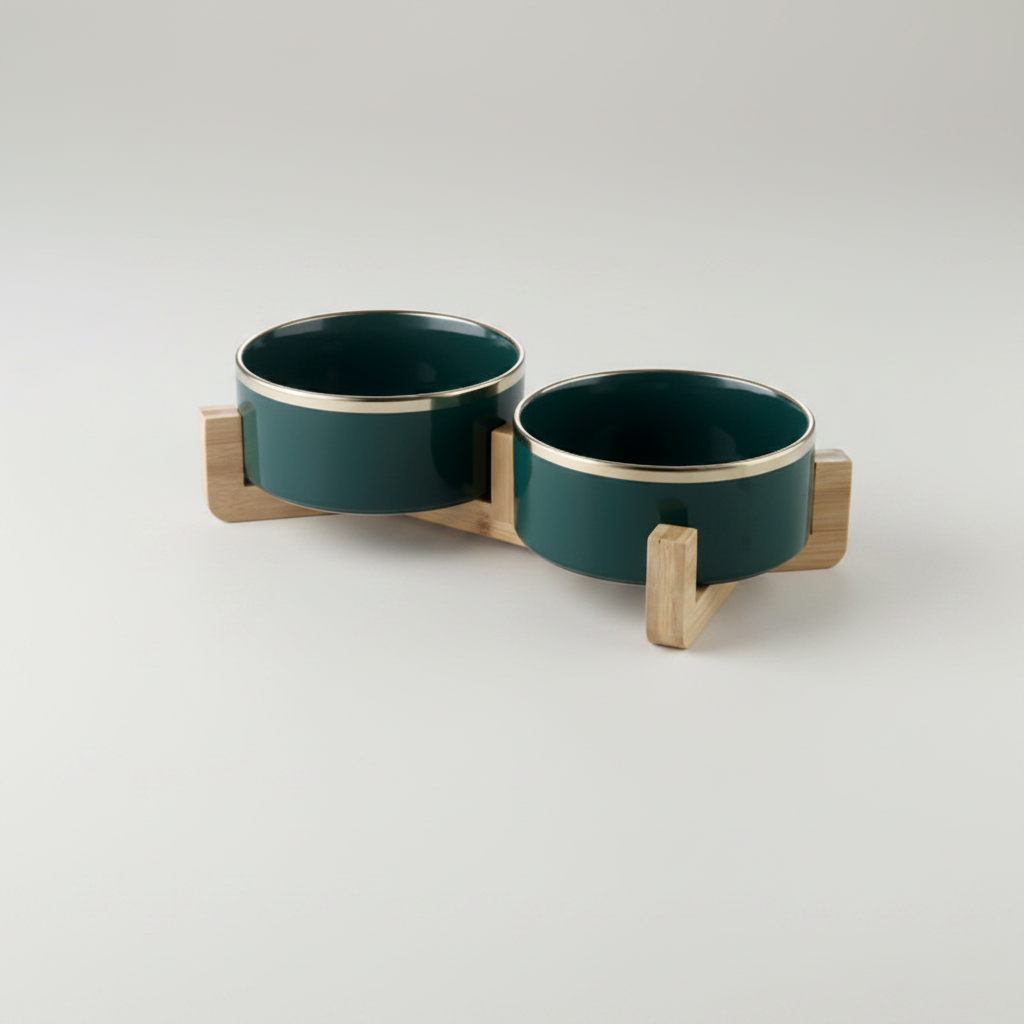 Forest green ceramic double dog bowl set with gold rim on bamboo stand