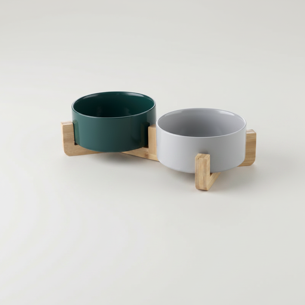Two-tone forest green and stone grey ceramic double bowl set on bamboo stand
