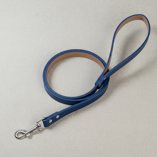 Blue genuine leather dog leash on neutral background